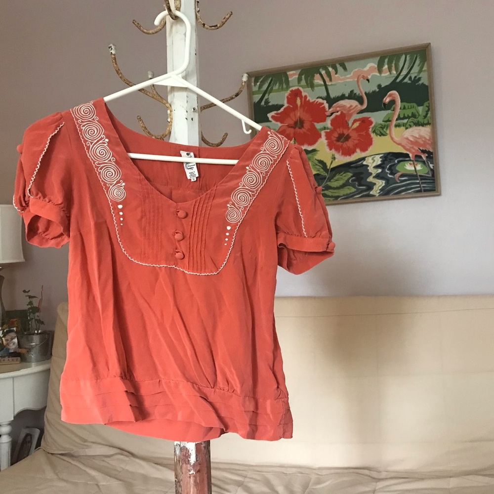 Elegant blouse decorated with buttons
